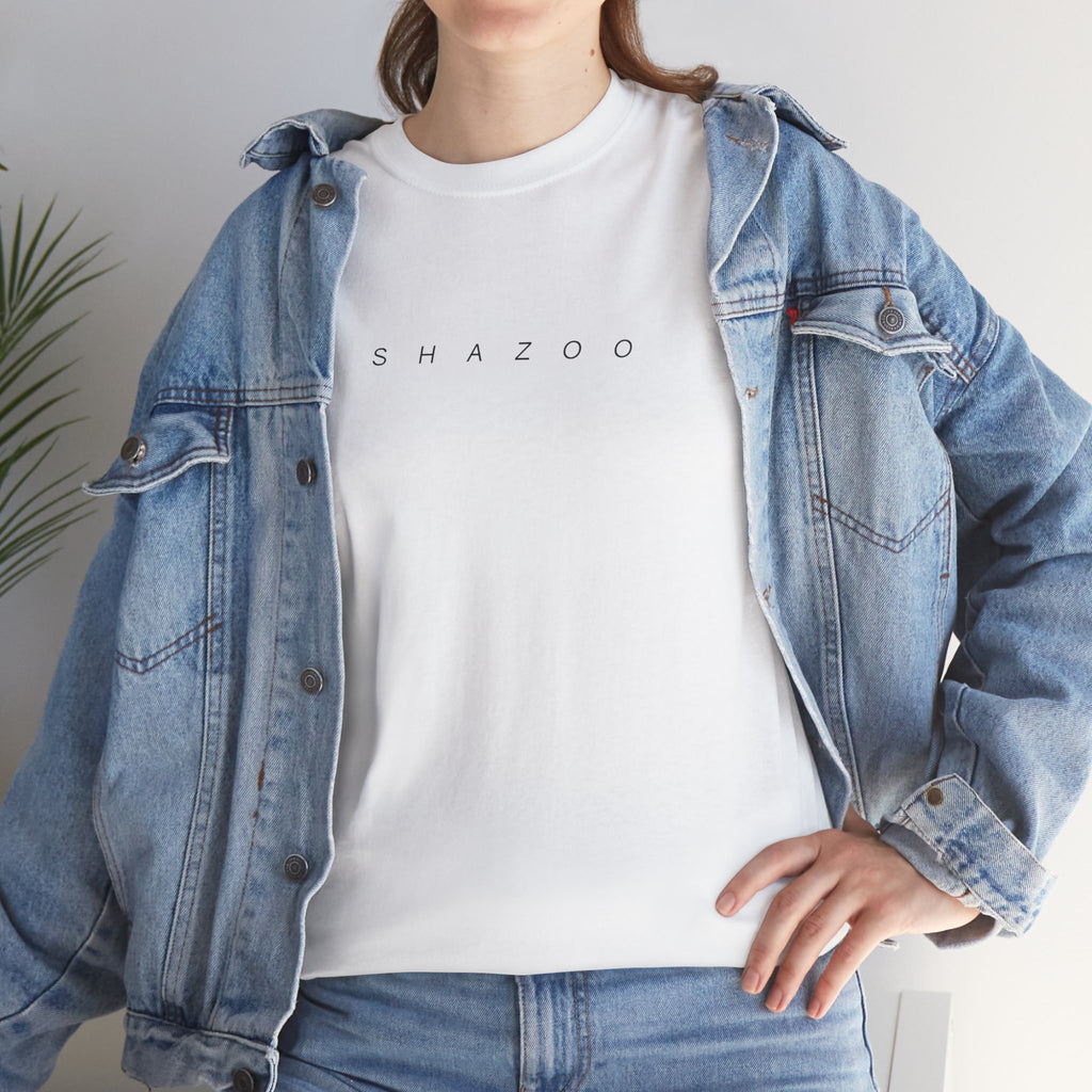 Person wearing a denim jacket over a white t-shirt with 'SHAZOO' text.