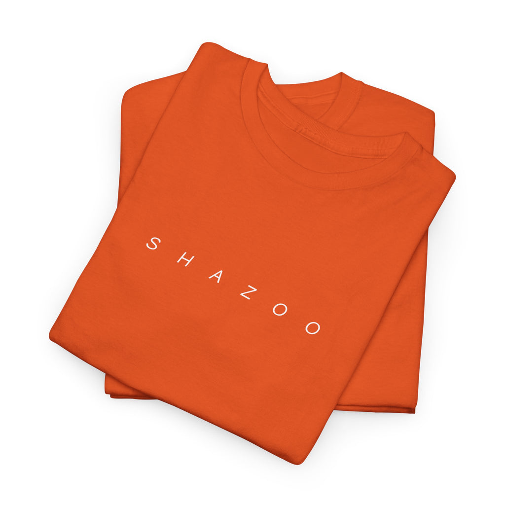Folded orange t-shirt with 'SHAZOO' text on a white background