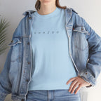 Person wearing a light blue shirt with 'SHAZOO' text and a denim jacket indoors.