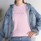 Person wearing a pink t-shirt with 'SHAZOO' text and a denim jacket.